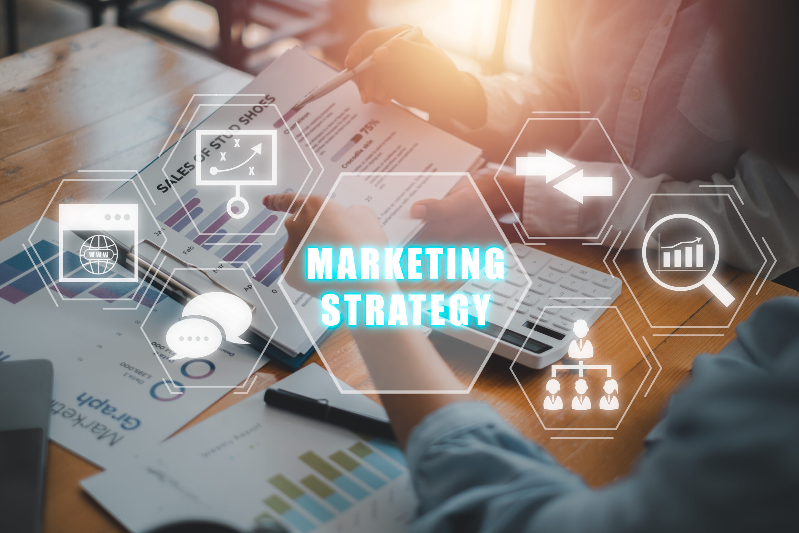 marketing strategy concept, business team analyzing income charts and graphs with marketing strategy icon on virtual screen.